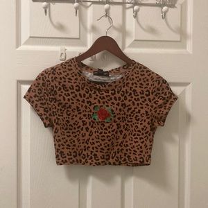 Cute crop top cheetah shirt with printed red rose. Size small.
